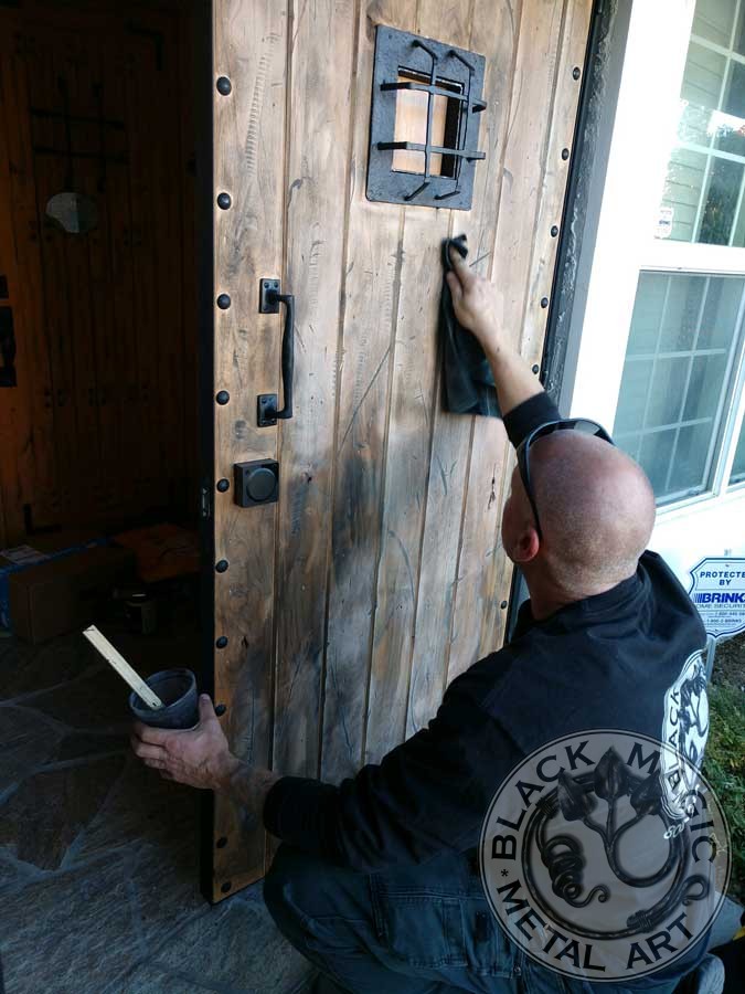 staining rustic barn door