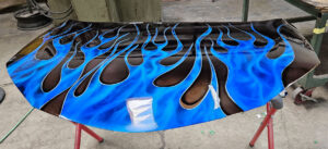 Custom blue flame finish on car hood