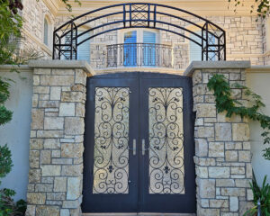 beautiful custom iron entry gate and handrails installed by Black Magic Metal Art in Ventura County