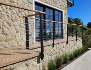 Exterior handrail installation with wood and metal materials