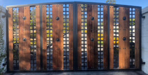 Custom steel driveway gate fabricated and installed by Black Magic Metal Art