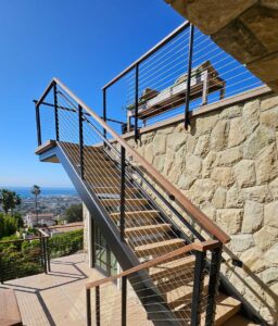 Multi-level wood and iron handrail design and installation