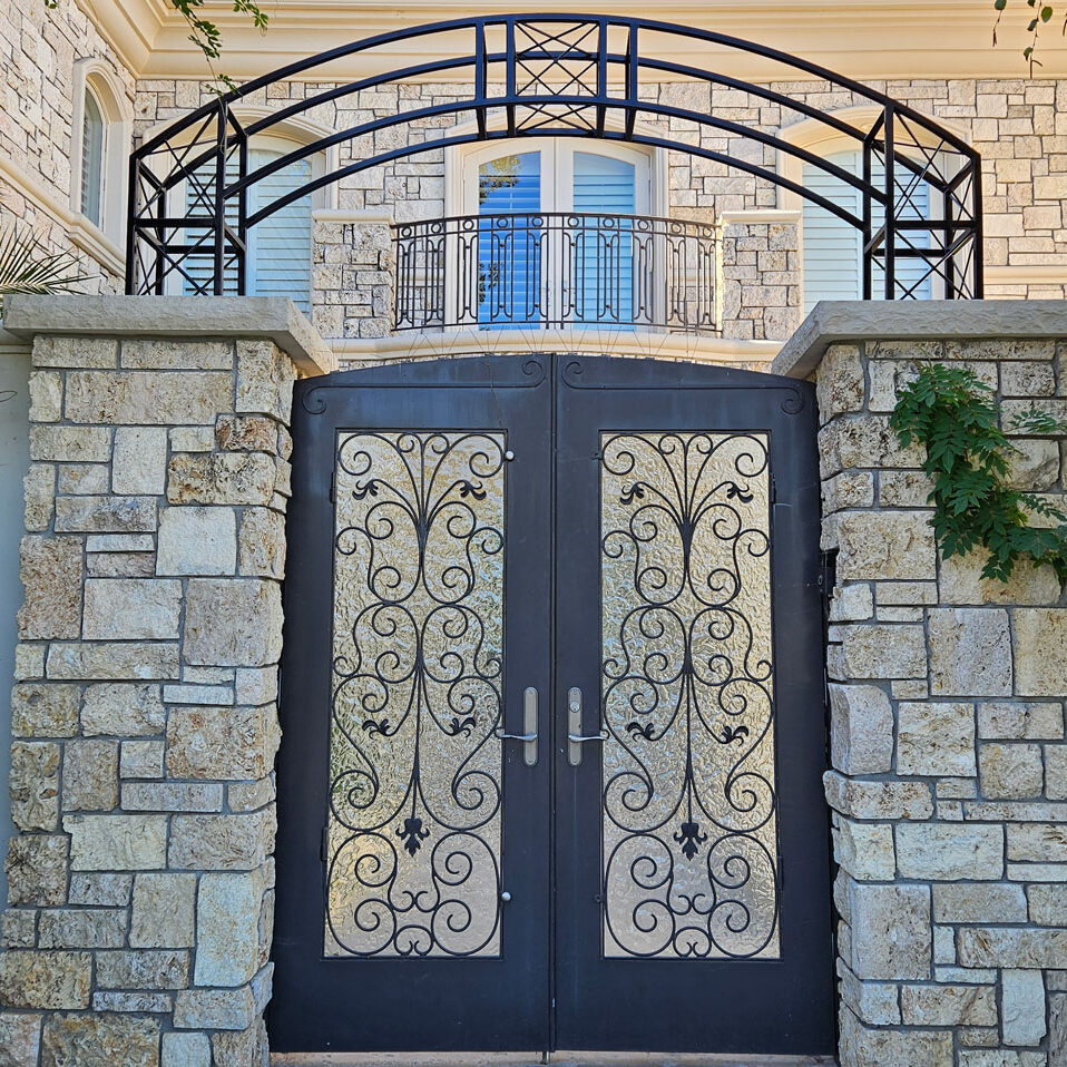beautiful custom iron entry gate and handrails installed by Black Magic Metal Art in Ventura County