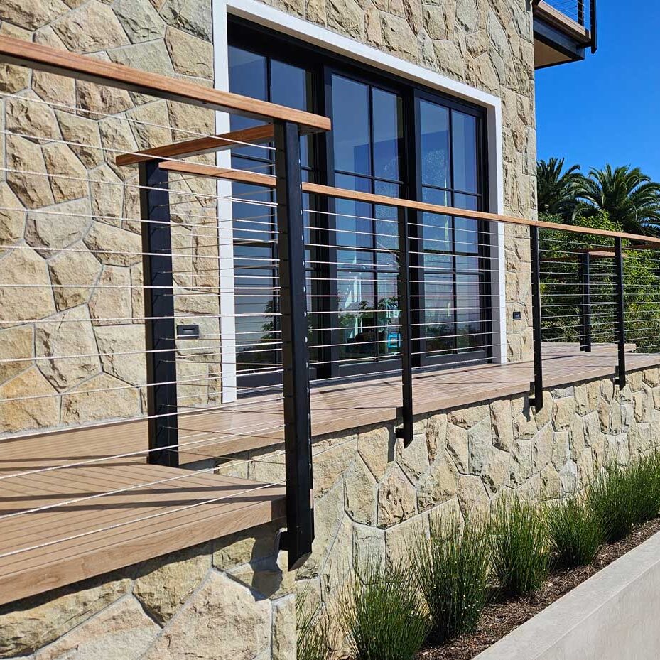 Exterior handrail installation with wood and metal materials