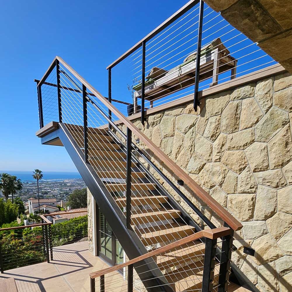 Multi-level wood and iron handrail design and installation